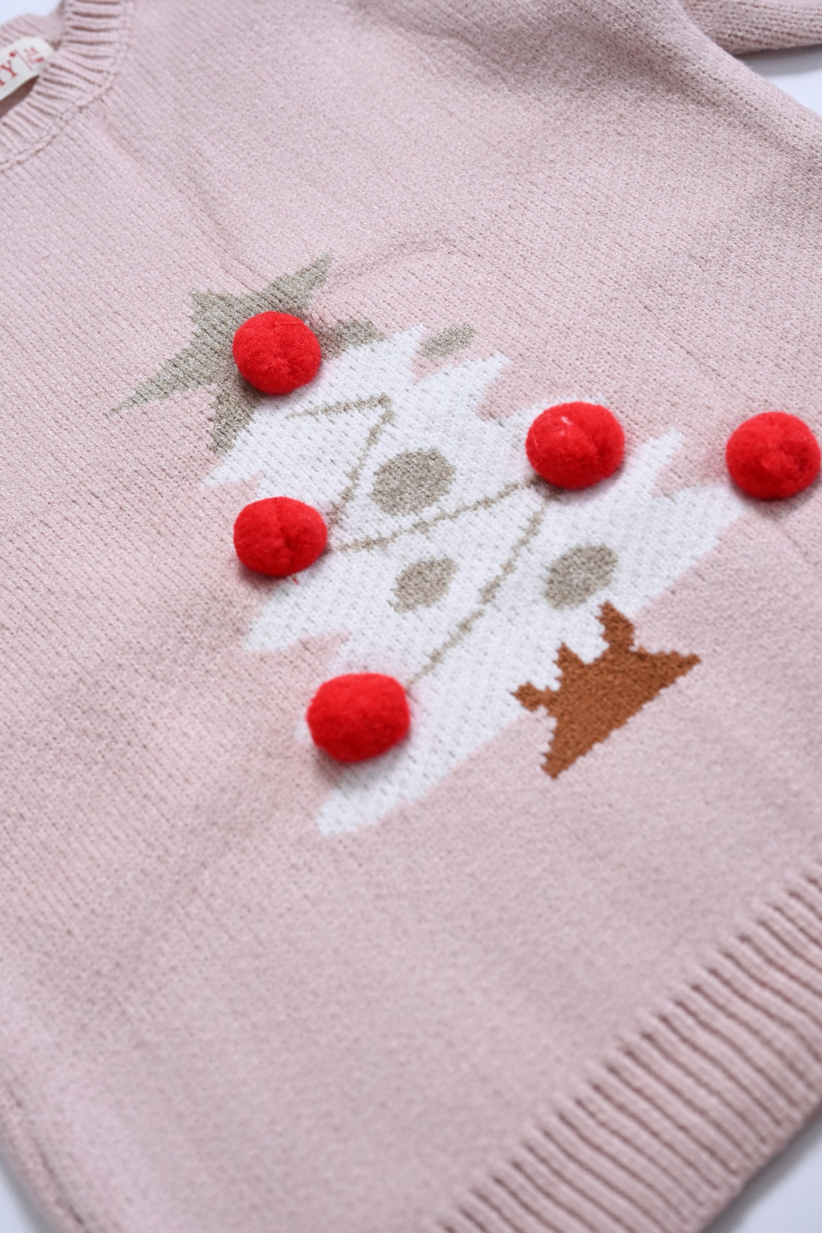 GIRL'S PEACH SWEATER Reality