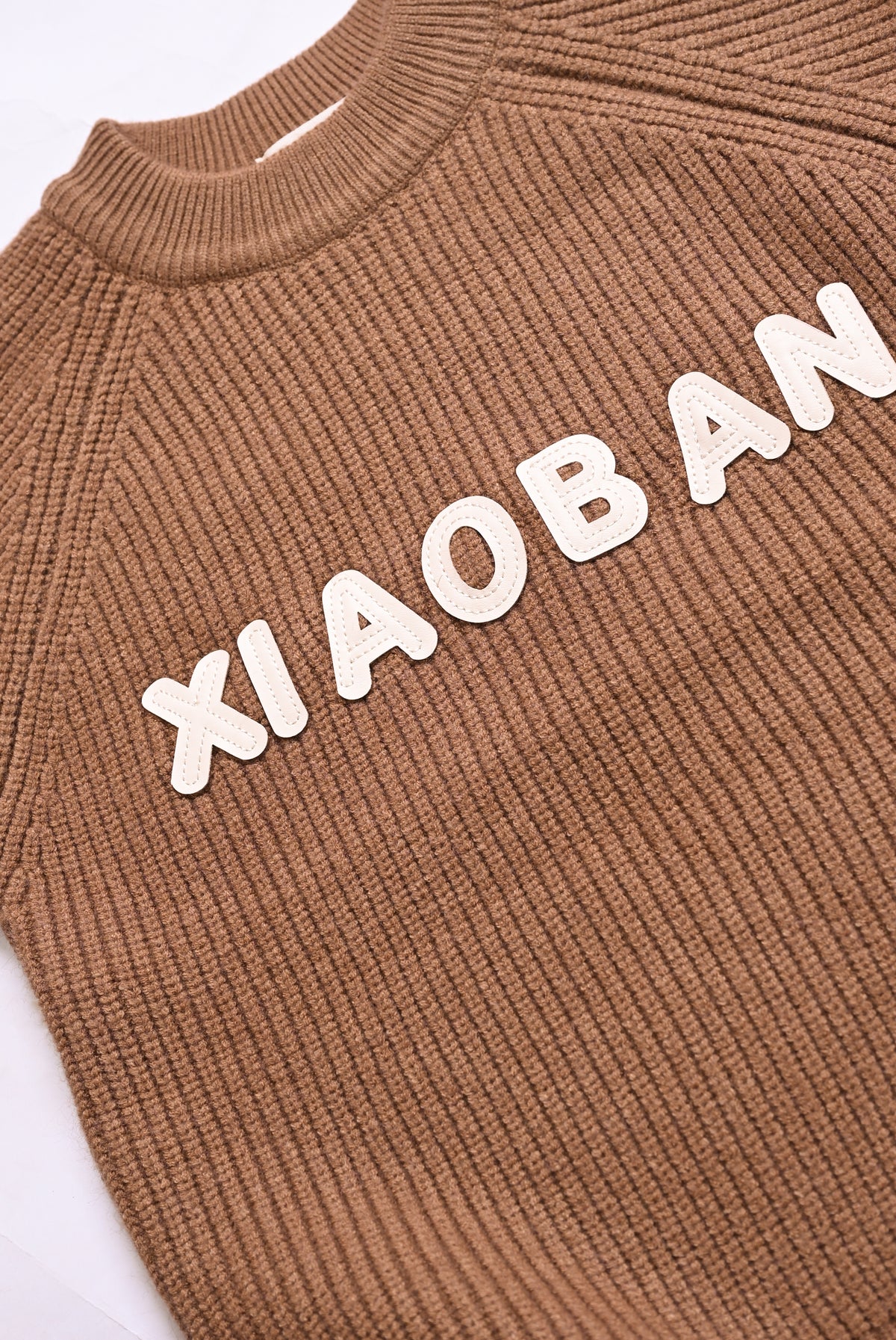 BROWN SWEATER Reality