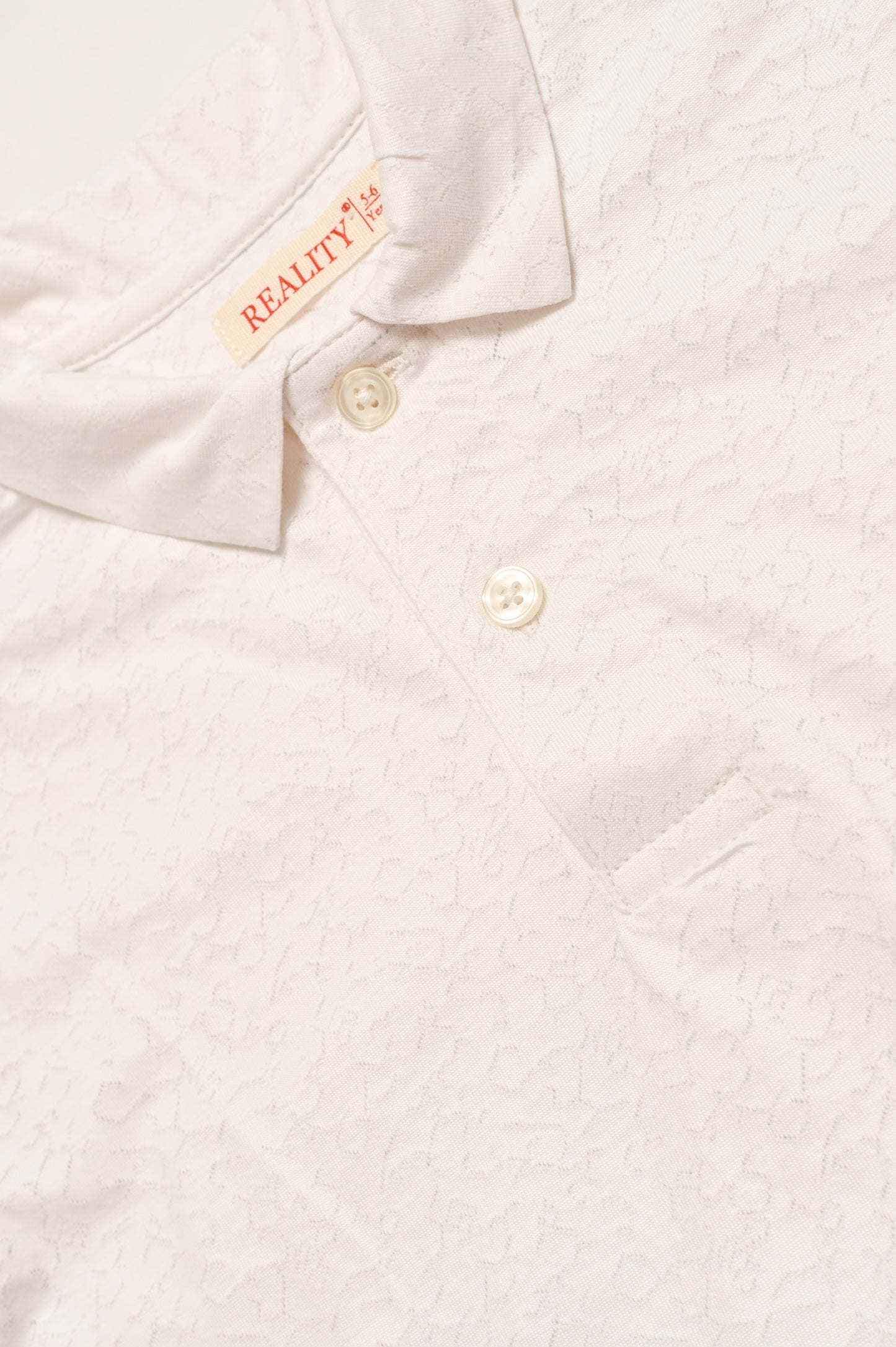 BOY PRINTED OFF WHITE POLO Reality