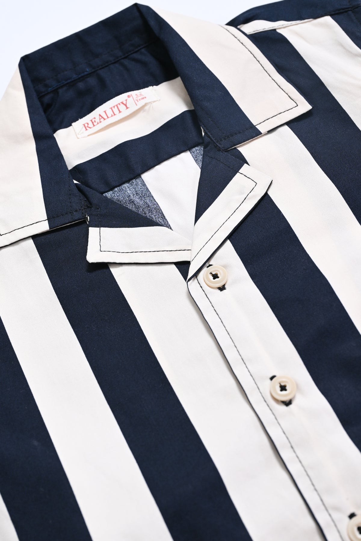BOY TEXTURE BUTTON CREAM SHIRT Reality