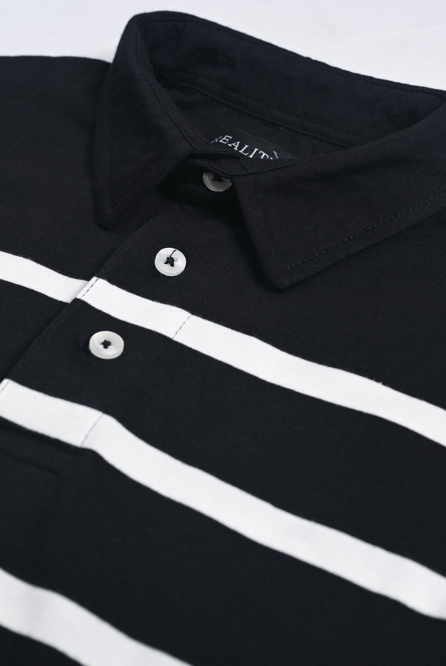 YARN DYED STRIPED BLACK POLO Reality