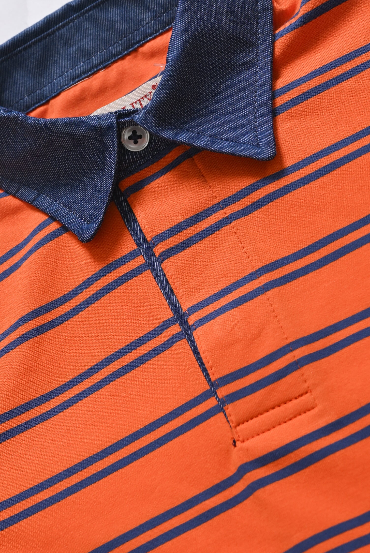 DENIM COLLAR ORANGE POLO Reality