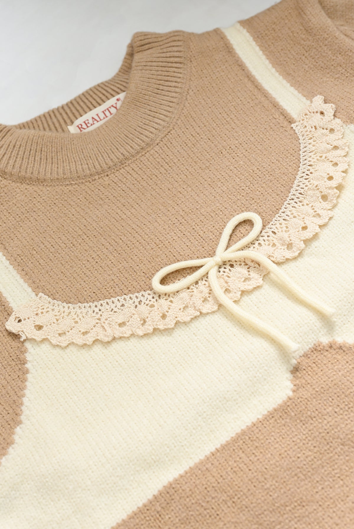 BEIGE SWEATER Reality