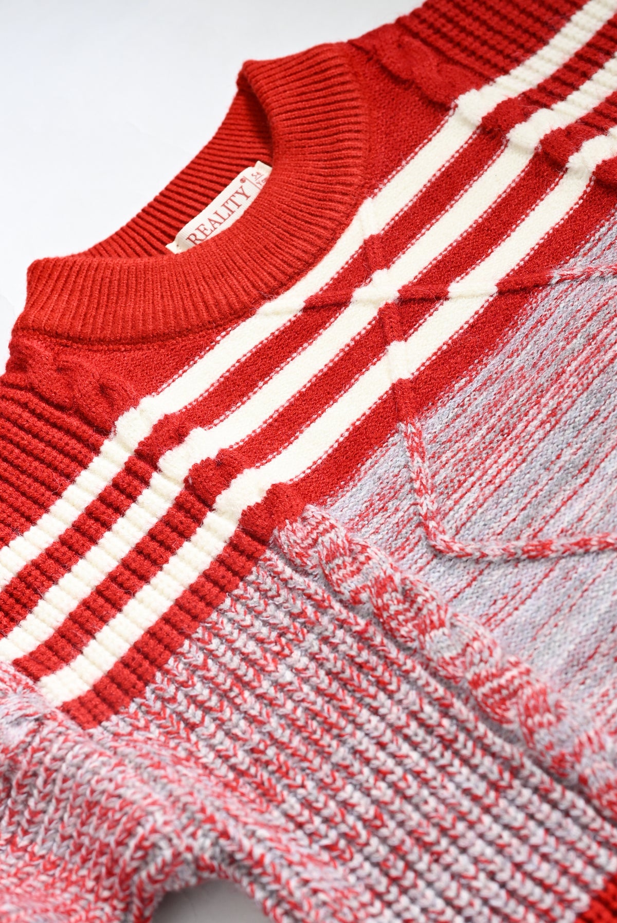 RED SWEATER Reality
