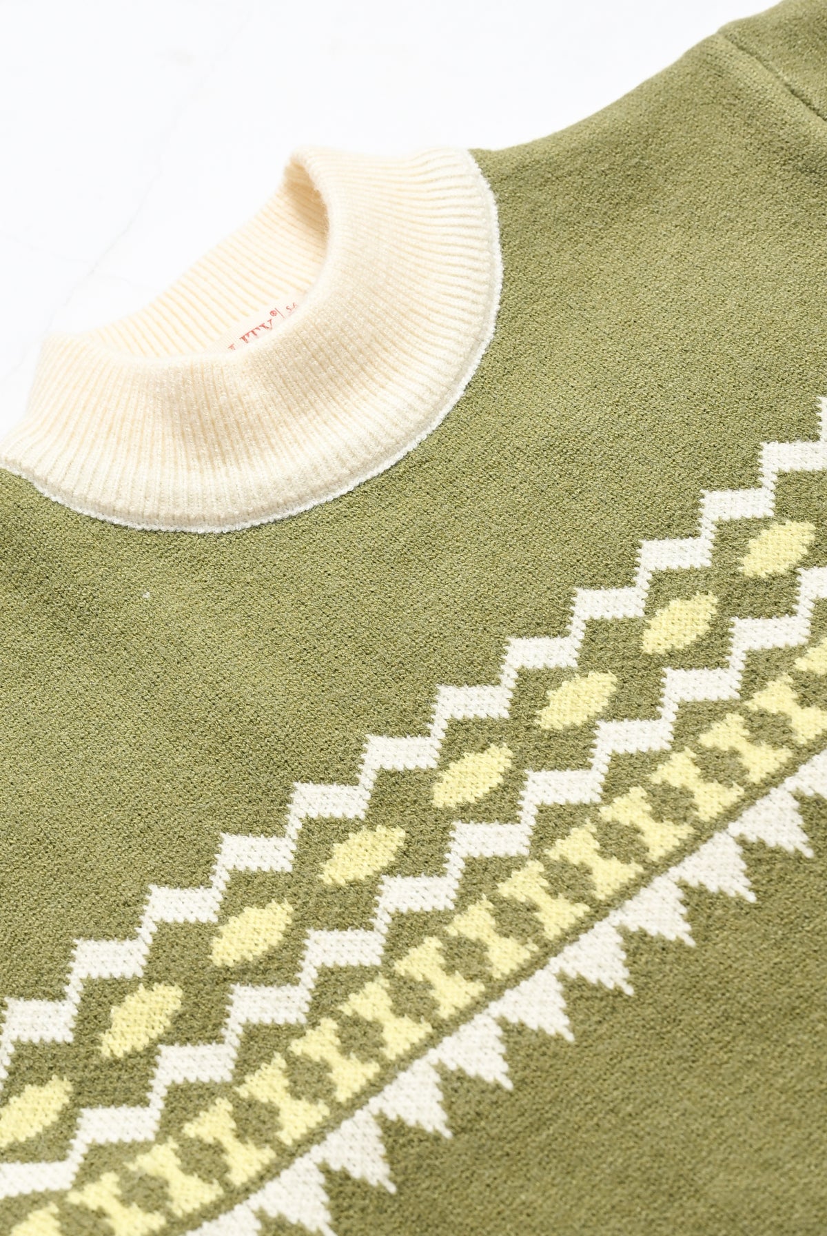 GREEN SWEATER Reality