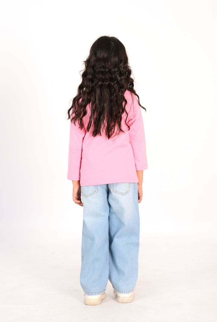 Young Girl in Pink "Bloom with Grace" Shirt and Light Wash Jeans Reality